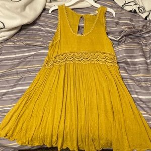 A size small in juniors section, never worn, brand Umgee, it’s a yellow dress
